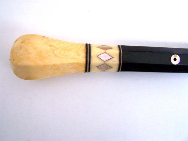 A 19th century Ebonized Walking Stick with ANTIQUE SCRIMSHAW carved Whale Ivory Knob, Baleen Spacers and Mother-of-pearl inlays.